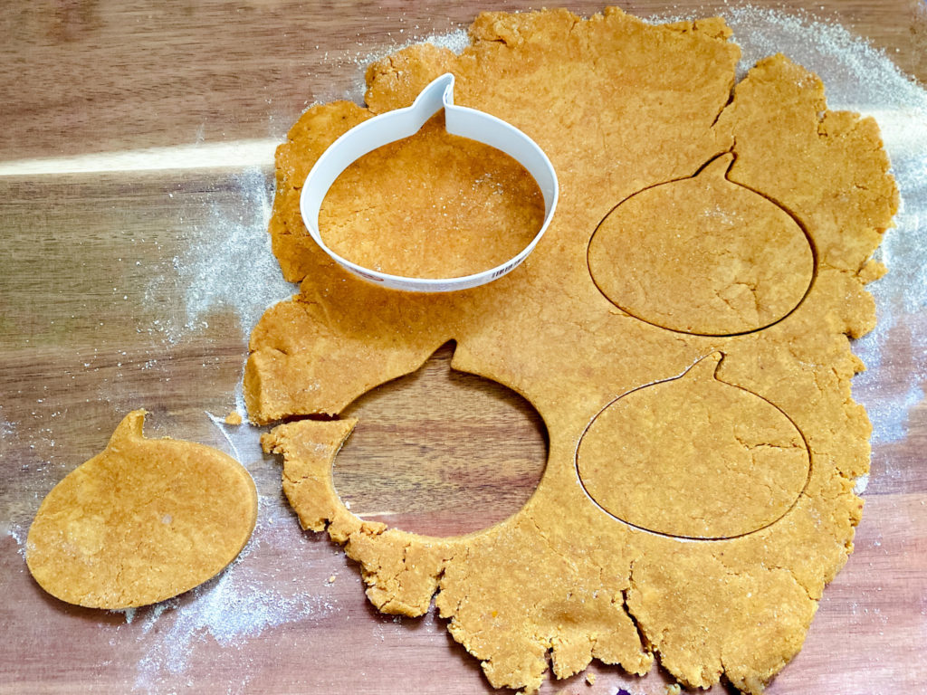 Peanut Butter and Pumpkin Dog Biscuits cut out in pumpkin shapes